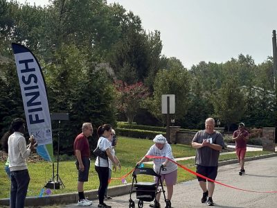 Woman at finish line with walker